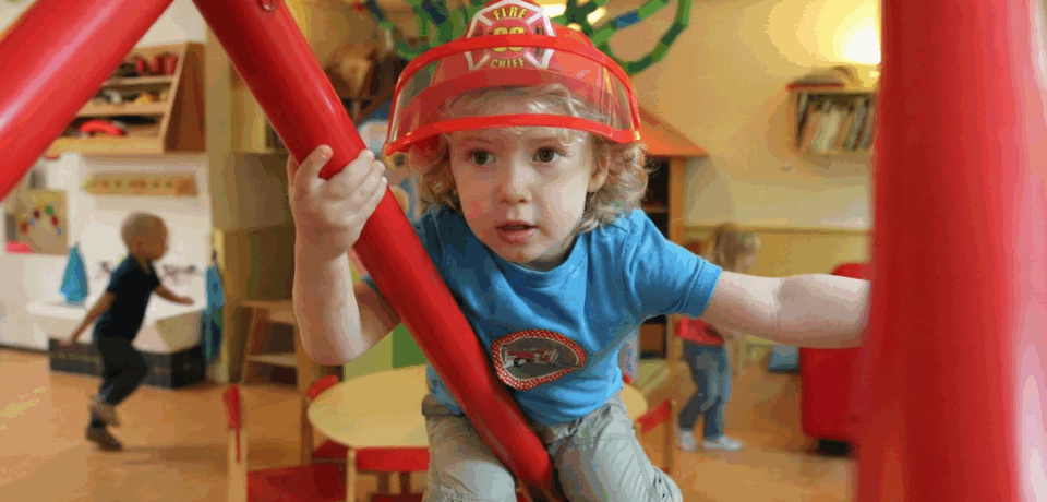 caucasian child in fireman hat